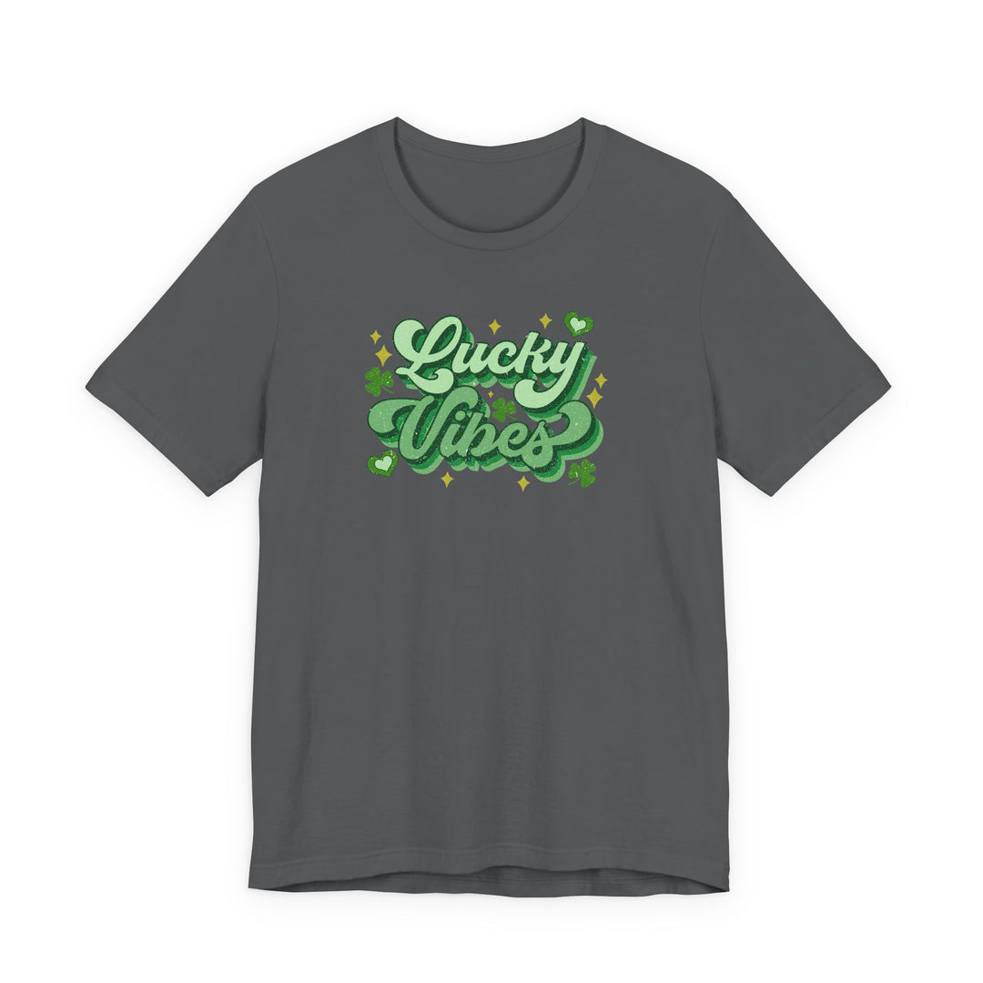 Charcoal crew-neck “Good Day Lucky Day Tee” with glittery green “Lucky Vibes” graphic, featuring shamrocks and hearts, ideal for St. Patrick’s Day celebrations.