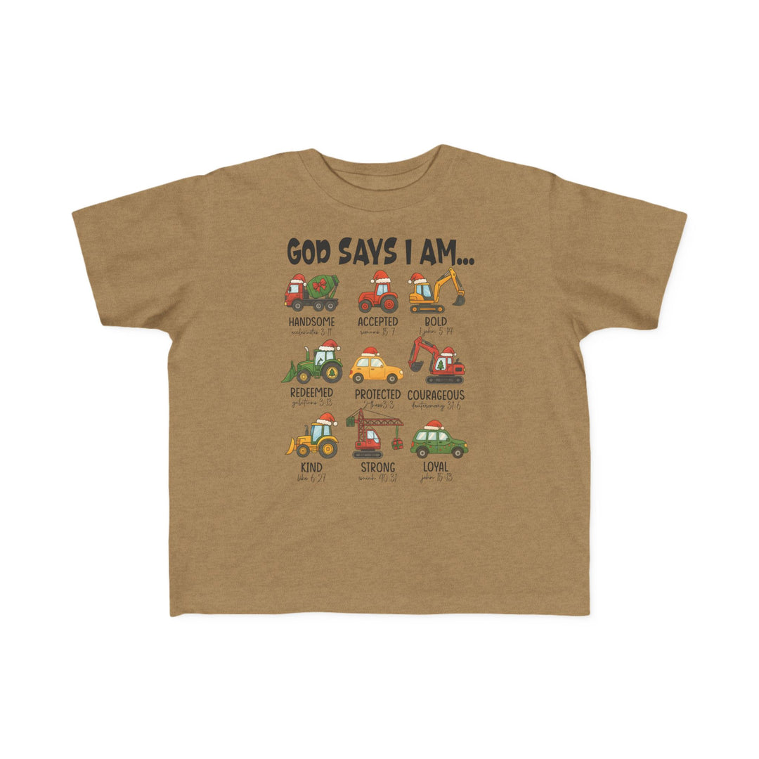 God Says Christmas Truck Toddler Tee features cartoon vehicles with Santa hats and positive traits, offering a soft, durable fit perfect for toddlers.