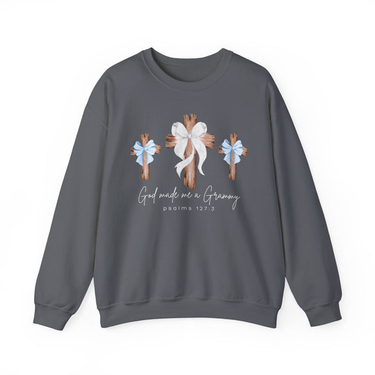 Charcoal-gray crewneck sweatshirt with three wooden crosses, blue and white bows, and God made me a Grammy text, combining comfort and faith-inspired design.