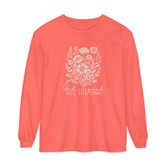 Coral long-sleeve crewneck tee with white floral design and God is good ALL THE TIME text, crafted from 100% ring-spun cotton for comfort.