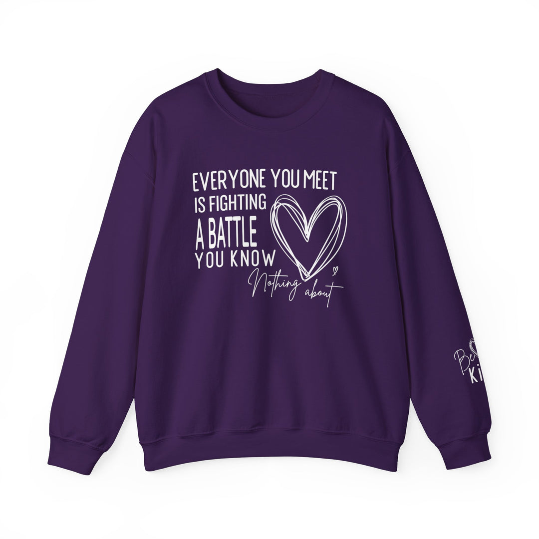 Fighting a Battle Crew: Purple sweatshirt with inspiring white graphic text, Everyone you meet is fighting a battle, hand-drawn heart, and Be Kind on the sleeve.