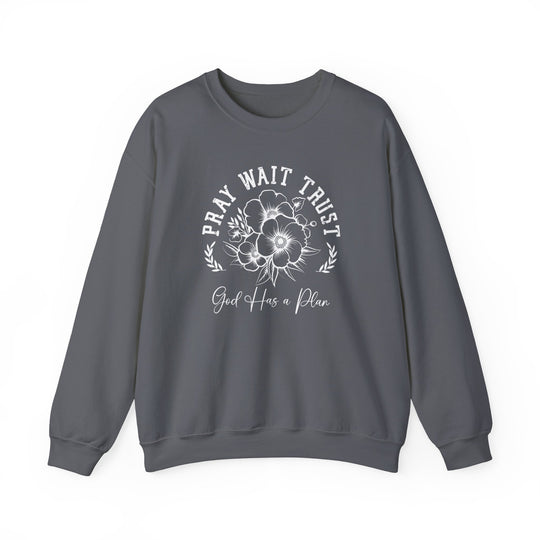 Pray Wait Trust Crew sweatshirt, grey with white text and floral accents, unisex heavy blend, ribbed collar, no side seams, ideal for comfort and style.