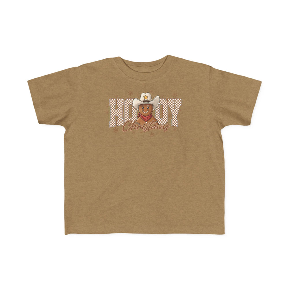 Howdy Christmas Toddler Tee featuring a cartoon gingerbread cowboy with Howdy Christmas text and snowflakes, designed for toddler comfort and style.