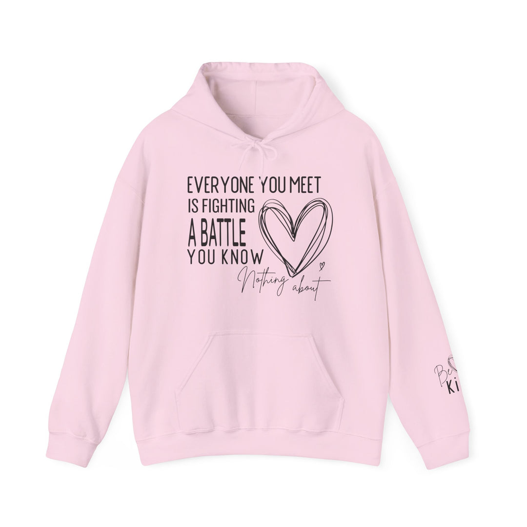 Pale-pink hoodie with a heart and motivational text on chest, EVERYONE YOU MEET IS FIGHTING A BATTLE YOU KNOW NOTHING ABOUT.