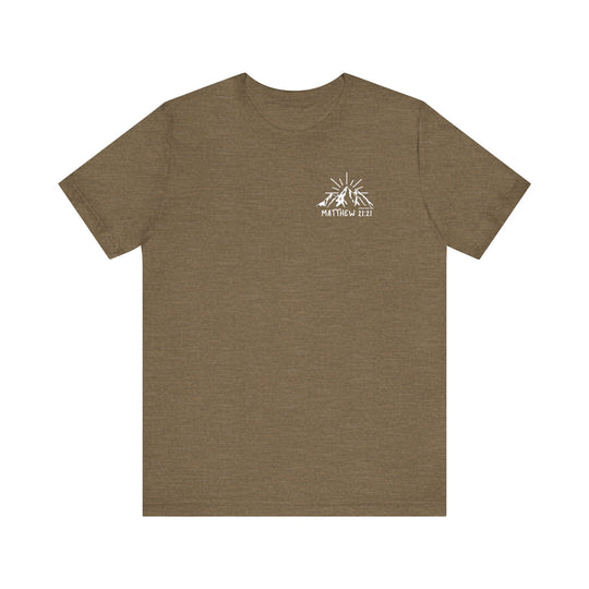 Brown tee with mountain logo, embodying Faith Can Move Mountains Tee from Worlds Worst Tees. Unisex jersey shirt with ribbed collar, 100% cotton, retail fit, tear away label, and durable seams.