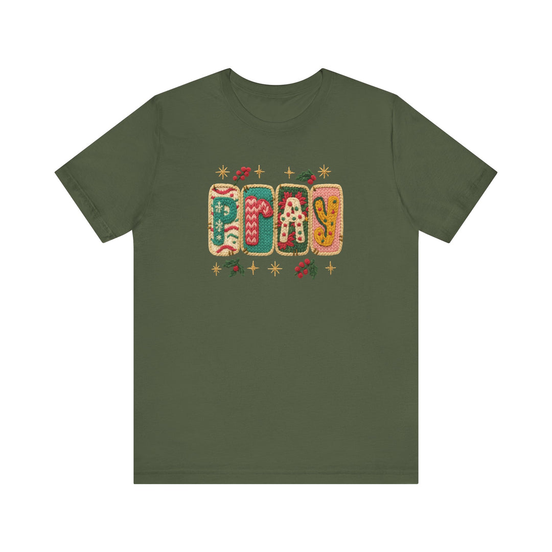 Olive-green Pray T-shirt with festive knitted-patch letters and motifs, offering a soft, unisex fit, perfect for holiday wear.