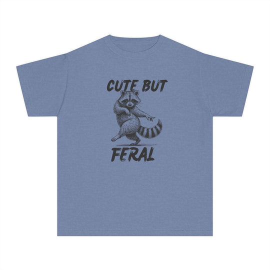 Cute but Feral Kids Tee featuring a playful raccoon illustration and bold text, designed for comfort with 100% combed cotton, ideal for active kids.
