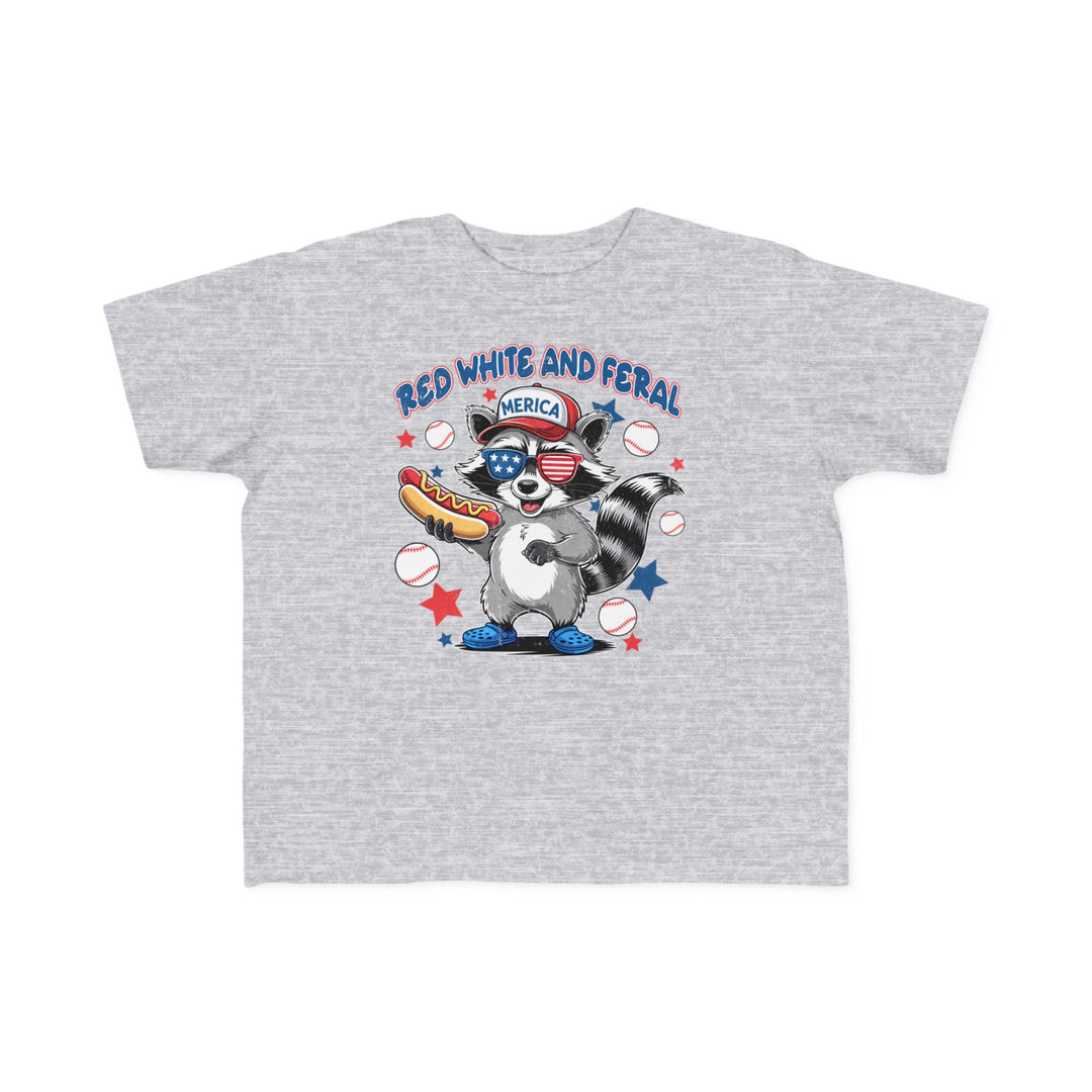 Toddler wearing the Red, White and Feral Baseball 4th Toddler Tee, showcasing its soft, durable cotton fabric, perfect for first adventures.
