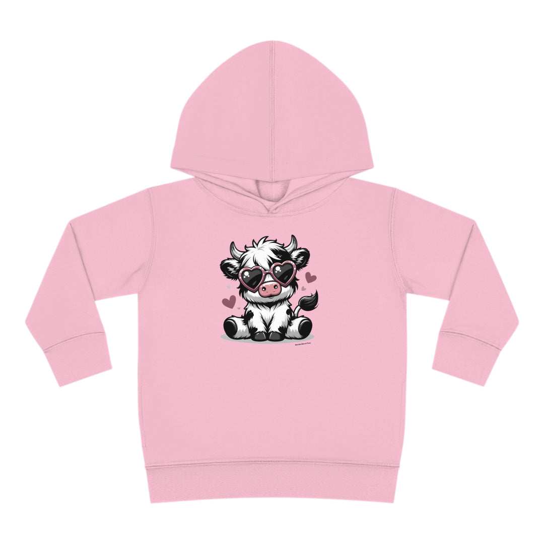 Cute Cow Toddler Hoodie with cartoon cow wearing sunglasses. Jersey-lined hood, cover-stitched details, side seam pockets for durability and coziness. Ideal for kids' comfort and play.