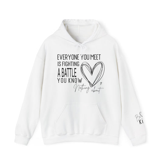 White pullover hoodie with Everyone You Meet Is Fighting a Battle text and heart sketch on chest; sleeve reads Be Kind with heart motif.