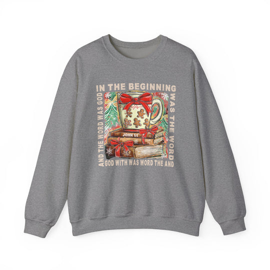 Grey crewneck sweatshirt, In the Beginning Crew, featuring a festive mug and books with John 1:1 scripture, surrounded by evergreen branches and snowflakes.