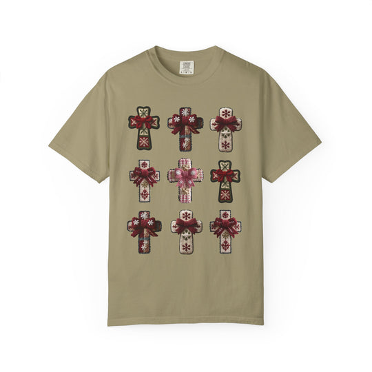 Crosses Tee featuring a khaki T-shirt with a 3x3 grid of stylized crosses, each resembling embroidered patches with snowflake motifs and bows.