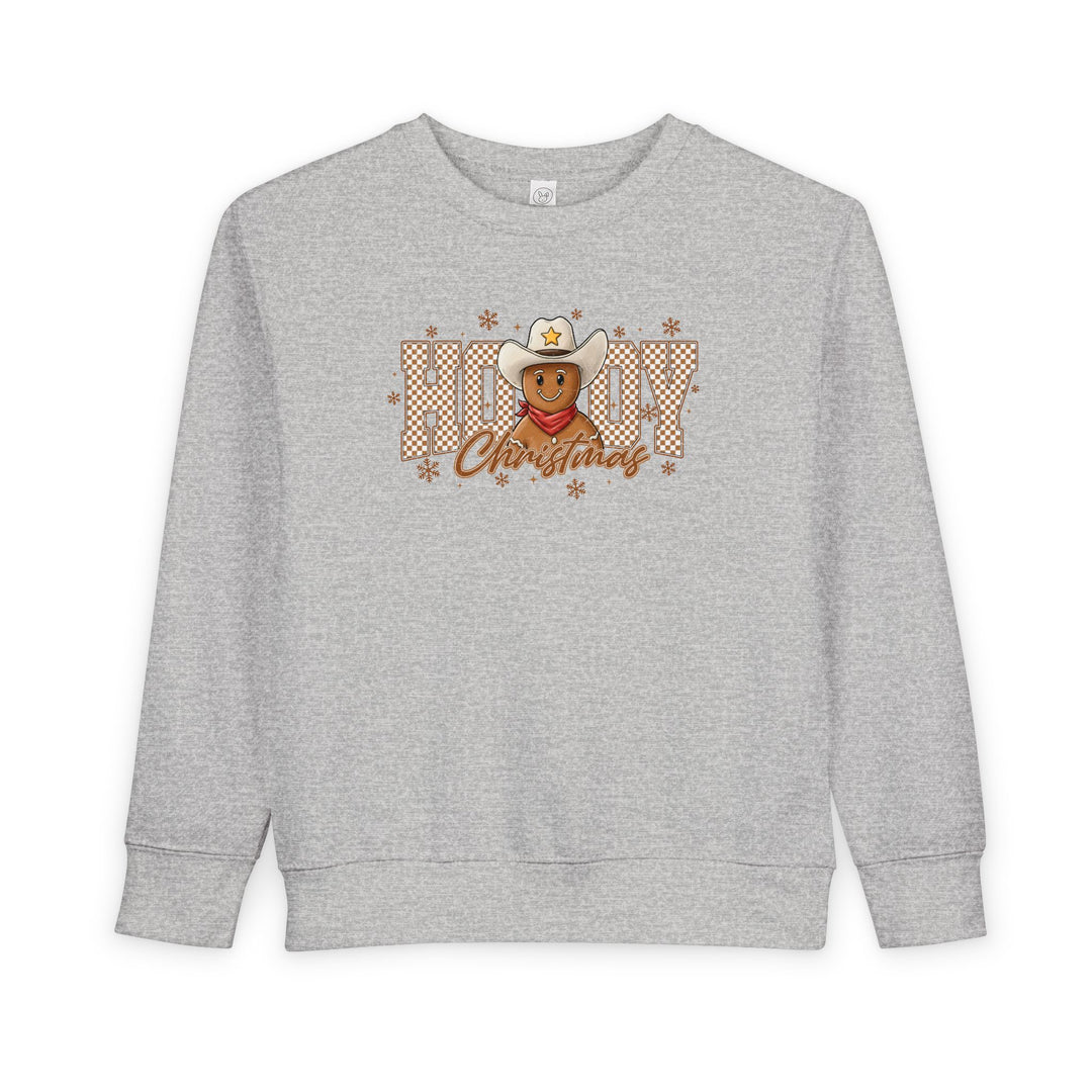Howdy Christmas Toddler Crew sweatshirt featuring a festive graphic with a cowboy-hat-wearing gingerbread man and snowflakes, ideal for keeping toddlers cozy and stylish.