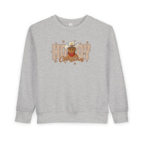 Howdy Christmas Toddler Crew sweatshirt featuring a festive graphic with a cowboy-hat-wearing gingerbread man and snowflakes, ideal for keeping toddlers cozy and stylish.