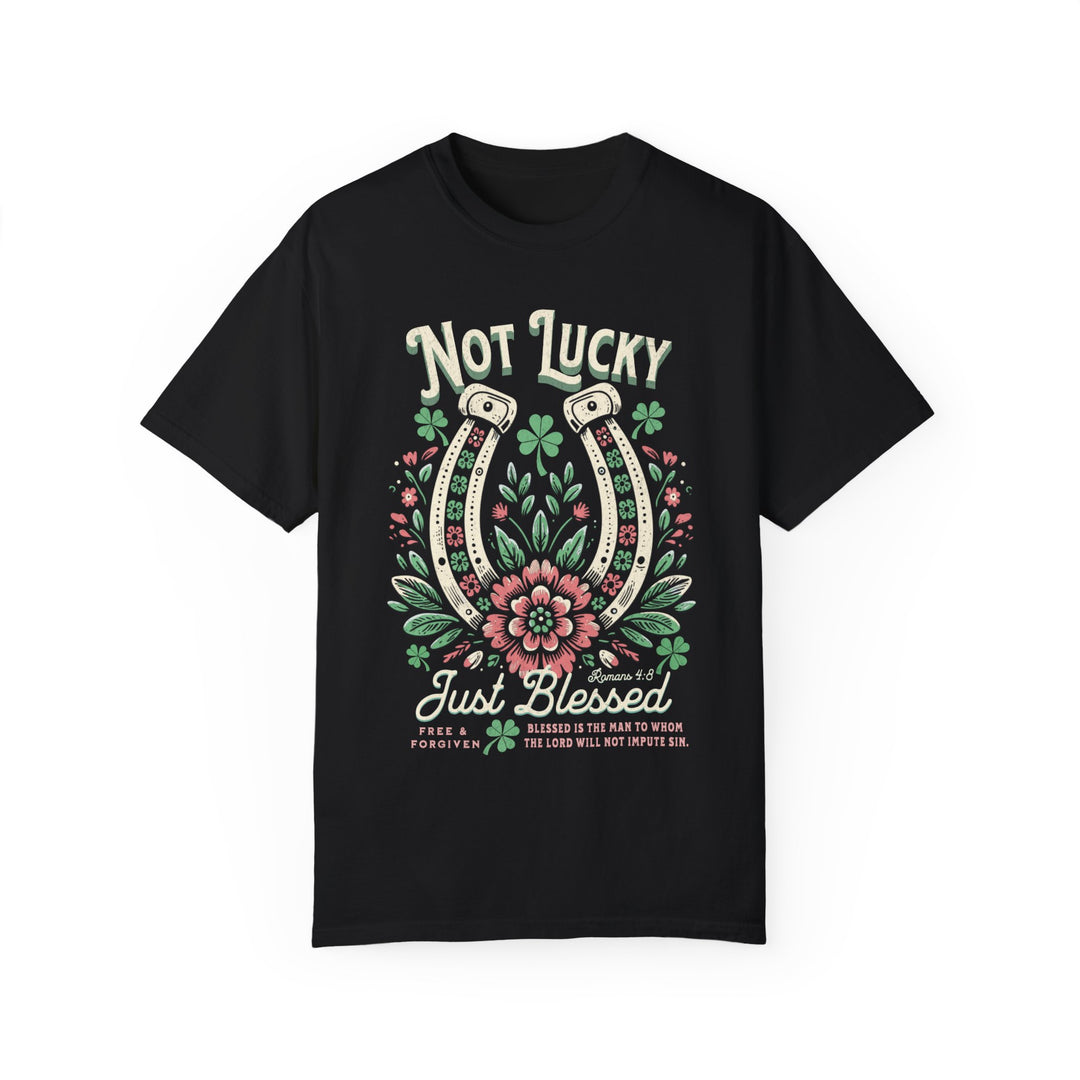 Black t-shirt featuring a graphic horseshoe with pink flowers, designed for comfort and durability, available in multiple sizes from Comfort Colors' Blessed Tee collection.