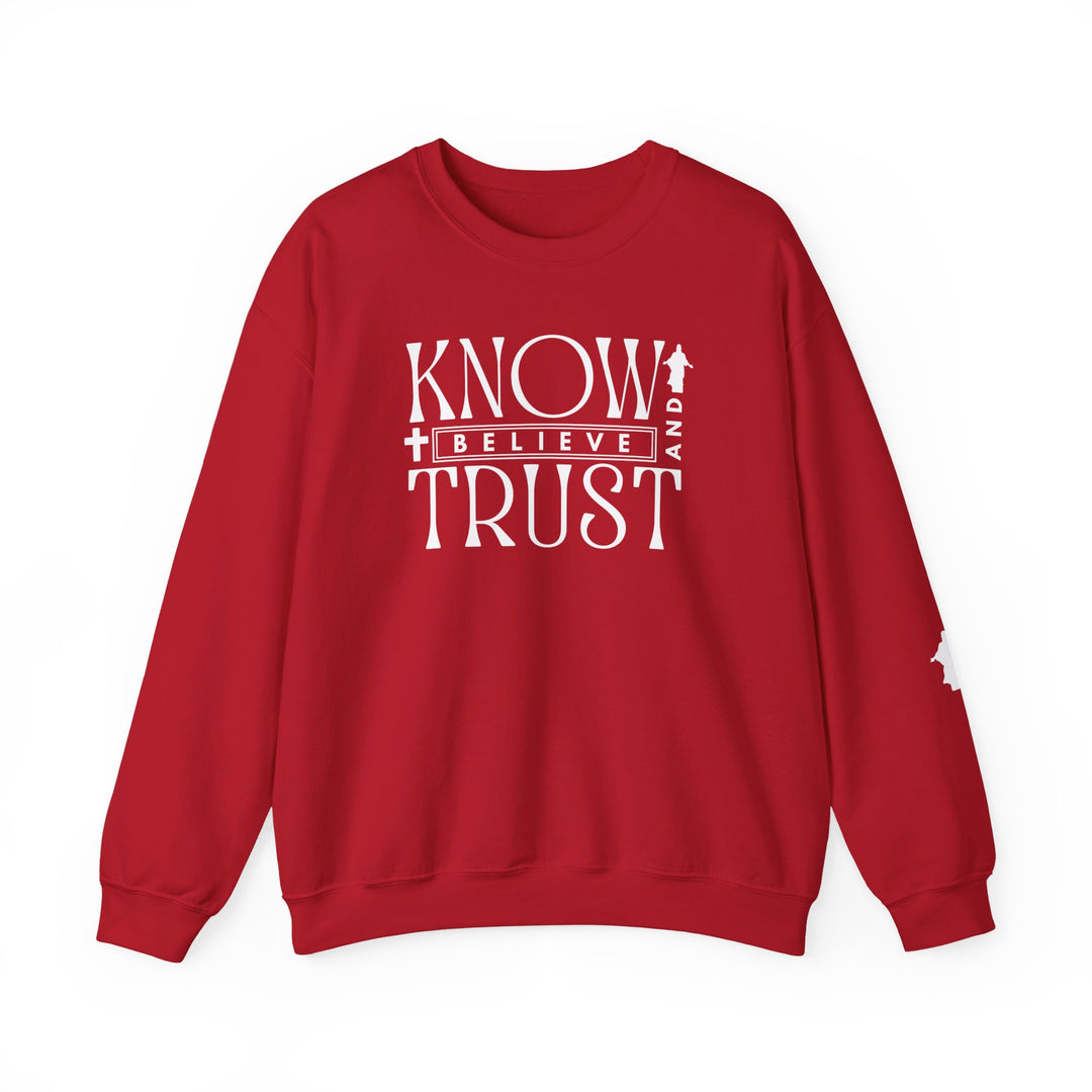 Trust, Know, Believe Crew: Red sweatshirt with white text, featuring a classic fit and crew neckline, made from a cozy cotton-polyester blend for comfort and durability.