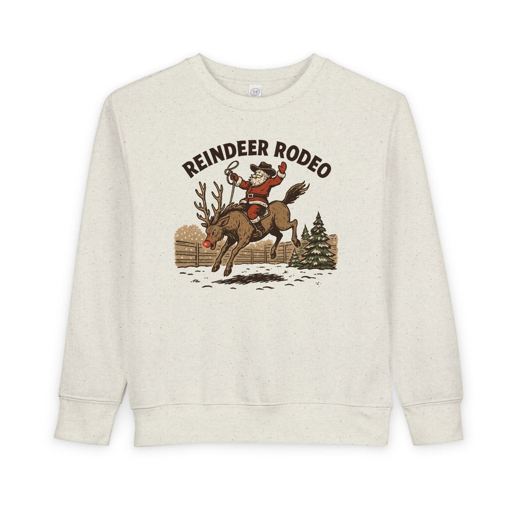 Reindeer Toddler Crew: Light-cream sweatshirt featuring Santa in cowboy attire riding a reindeer, perfect for keeping toddlers warm and stylish during festive seasons.