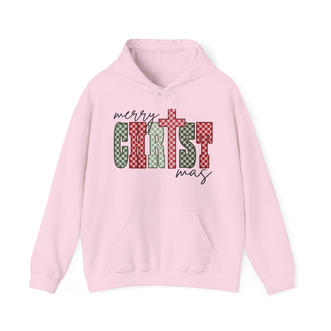 Light-pink Christmas Hoodie featuring a merry Christmas graphic with a checkerboard pattern, kangaroo pocket, and drawstring hood, offering warmth and style.