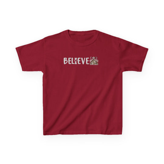 Kids' Believe Tee: Red short-sleeve T-shirt with BELIEVE in Christmas/gingerbread style, featuring frosted cookie letters and gingerbread motifs, perfect for everyday wear.
