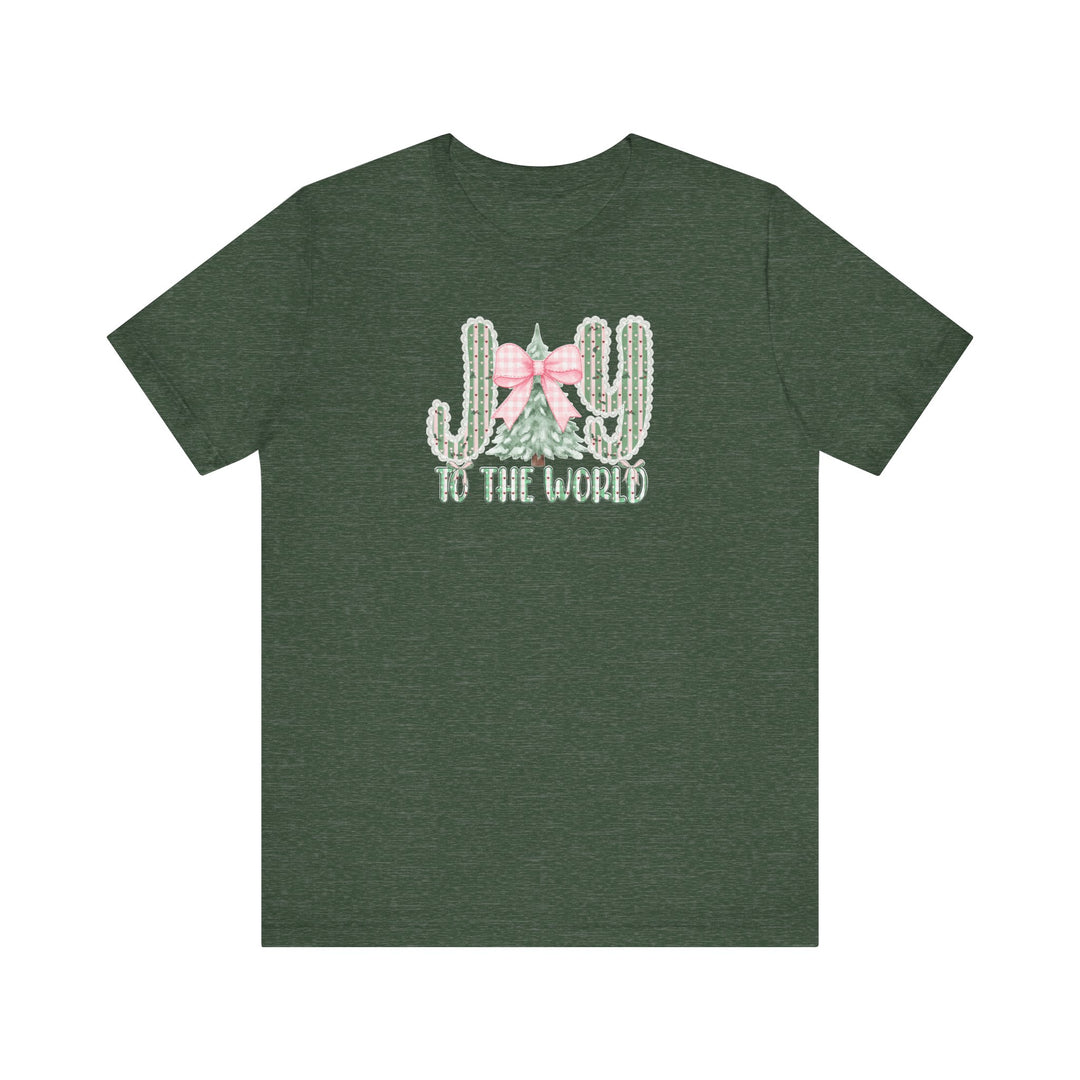 Joy to the World Tee: Festive dark-green T-shirt featuring JOY with cacti and pine tree graphic, pink gingham bow, and TO THE WORLD lettering. Classic fit, soft cotton.