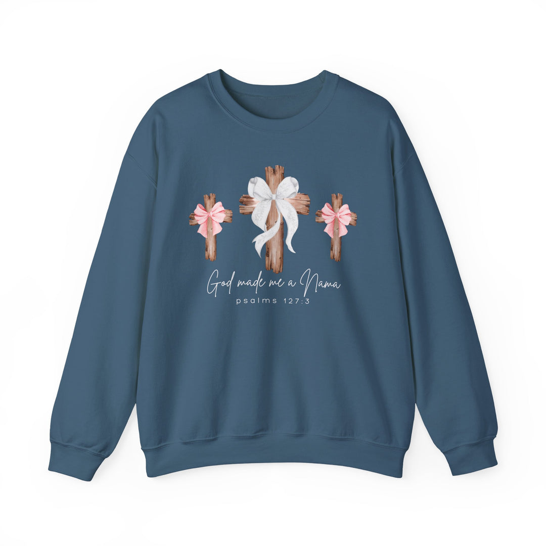 Slate-blue sweatshirt with three wooden crosses, center with white bow, sides with pink bows, text God made me a Nana and psalms 127:3 below.