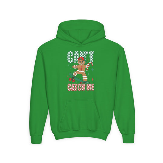 Can't Catch Me Youth Hoodie features a gingerbread character on a skateboard, holding a candy cane, with a checkered CAN’T CATCH ME graphic. Ultra-soft, preshrunk fleece.