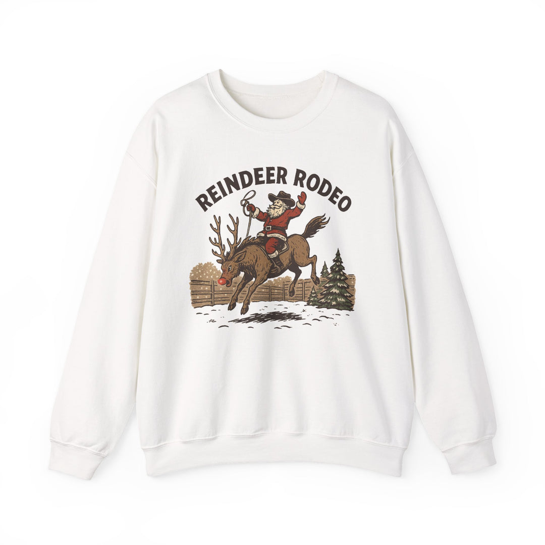 White crewneck sweatshirt featuring a retro Reindeer Rodeo graphic with Santa in cowboy attire riding a reindeer, ideal for cozy, stylish winter wear.