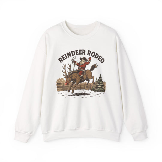 White crewneck sweatshirt featuring a retro Reindeer Rodeo graphic with Santa in cowboy attire riding a reindeer, ideal for cozy, stylish winter wear.