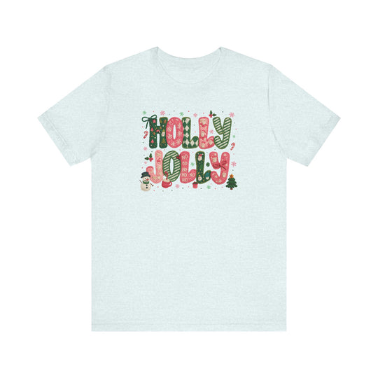 Holly Jolly Tee featuring festive holiday graphics with 'HOLLY JOLLY' in red, green, white patterns, Christmas motifs, on a light-colored unisex cotton T-shirt.