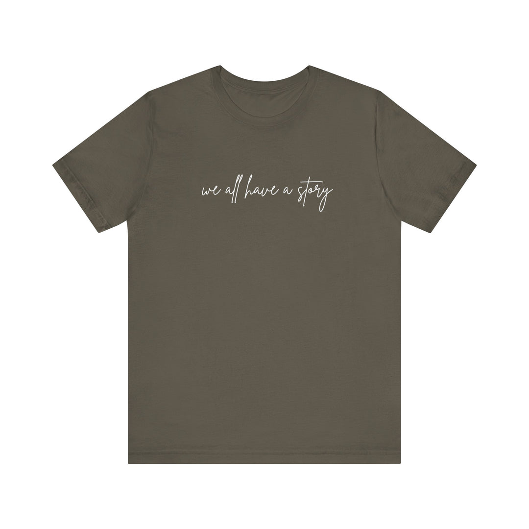 We all have a Story Tee, featuring white text on a grey t-shirt, perfect for casual wear with soft cotton and a comfortable fit.