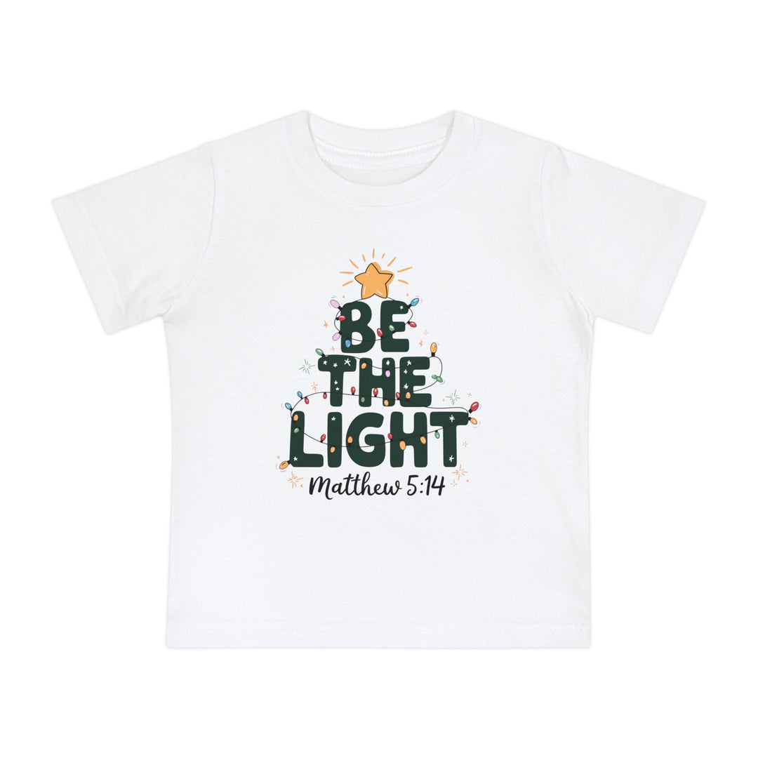 Be the Light Baby Tee: White kids' T-shirt with a festive Christmas tree design, featuring 'BE THE LIGHT', colorful lights, and 'Matthew 5:14' reference.