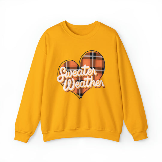 A cozy unisex heavy blend crewneck sweatshirt, the Sweater Weather Crew, featuring a yellow heart design. Made of 50% cotton and 50% polyester, with a ribbed knit collar and no itchy side seams.