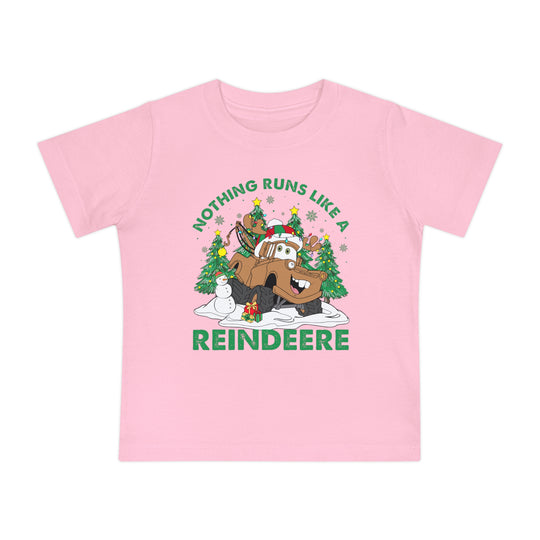 Reindeere Baby Tee with festive tow-truck as reindeer, surrounded by snow, trees, snowman, gift, and slogan Nothing runs like a Reindeere.