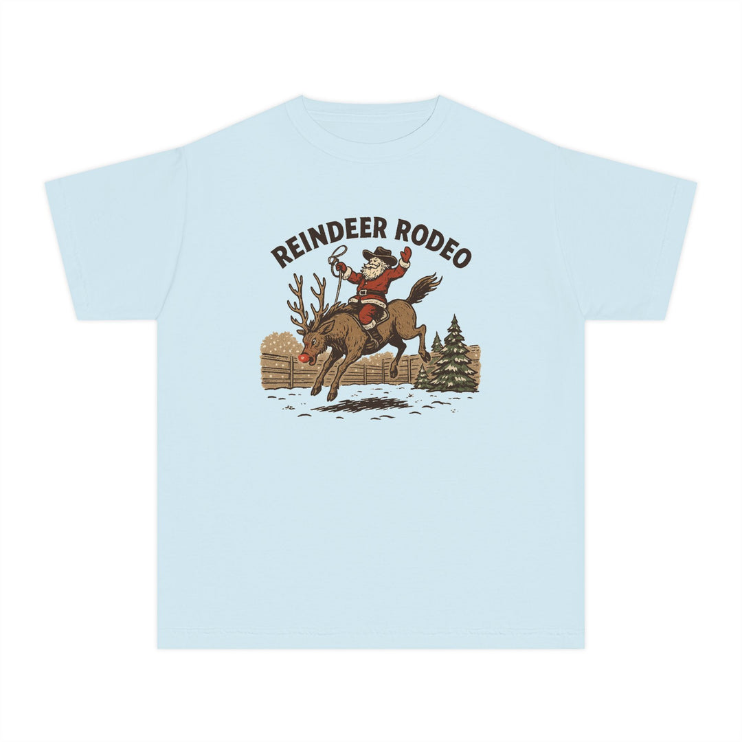 Reindeer Rodeo Kids Tee: Light-blue T-shirt with Santa in cowboy gear on a bucking reindeer, perfect for active kids with its comfortable, soft-washed cotton fabric.