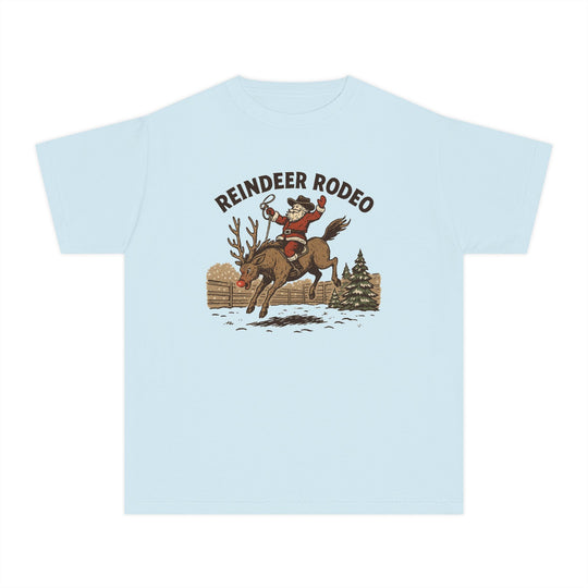 Reindeer Rodeo Kids Tee: Light-blue T-shirt with Santa in cowboy gear on a bucking reindeer, perfect for active kids with its comfortable, soft-washed cotton fabric.