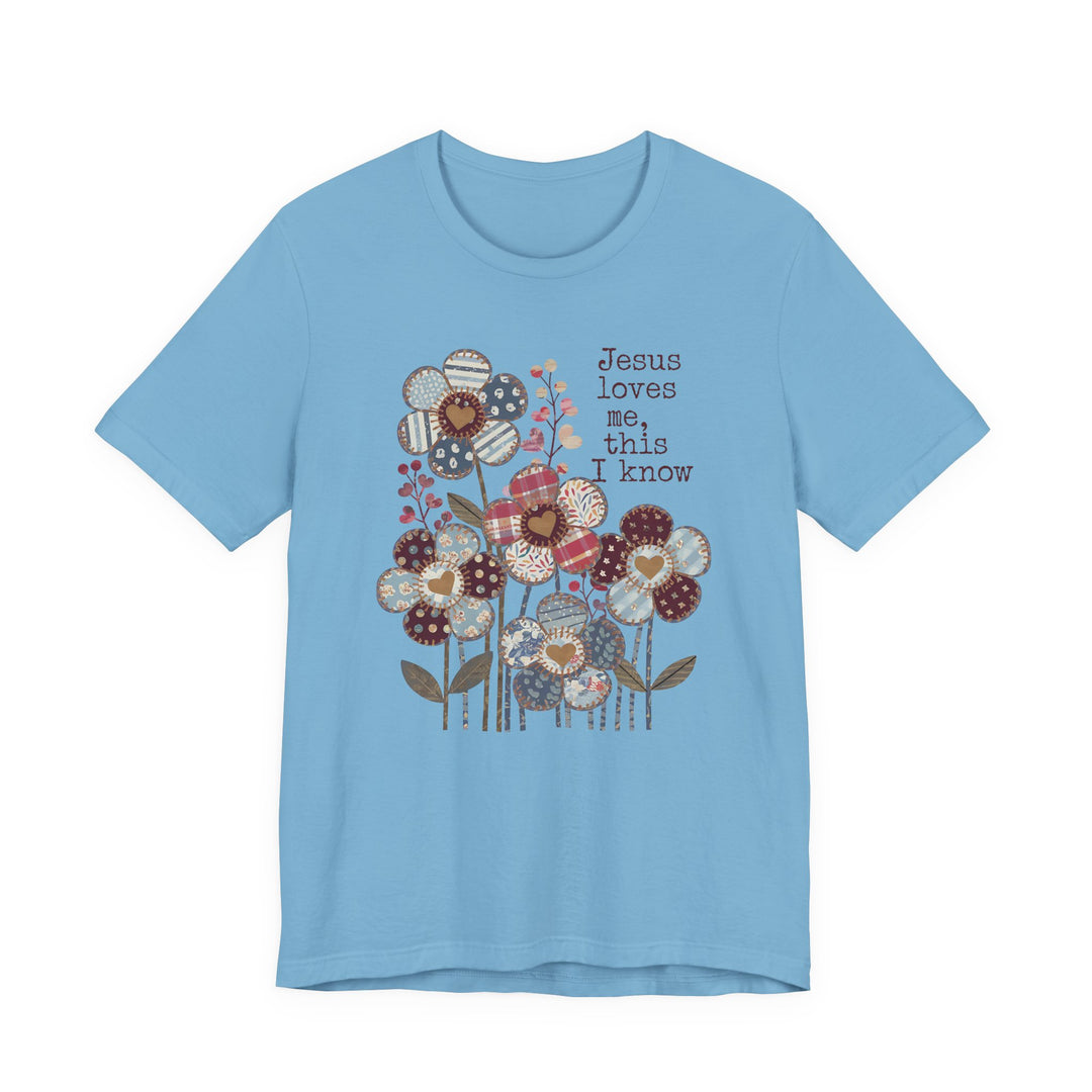Jesus Loves Me Tee with patchwork flowers, short sleeves, crafted from soft cotton for a comfortable fit, featuring ribbed collars and durable dual side seams.
