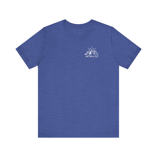 Unisex blue tee with mountain logo, embodying Faith Can Move Mountains Tee by Worlds Worst Tees. 100% cotton, ribbed knit collar, retail fit, tear away label, true to size.