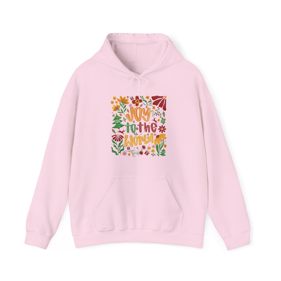 Light-pink hoodie with Joy to the World in festive colors, featuring holiday and floral illustrations, laid flat, showcasing its cozy, unisex design.