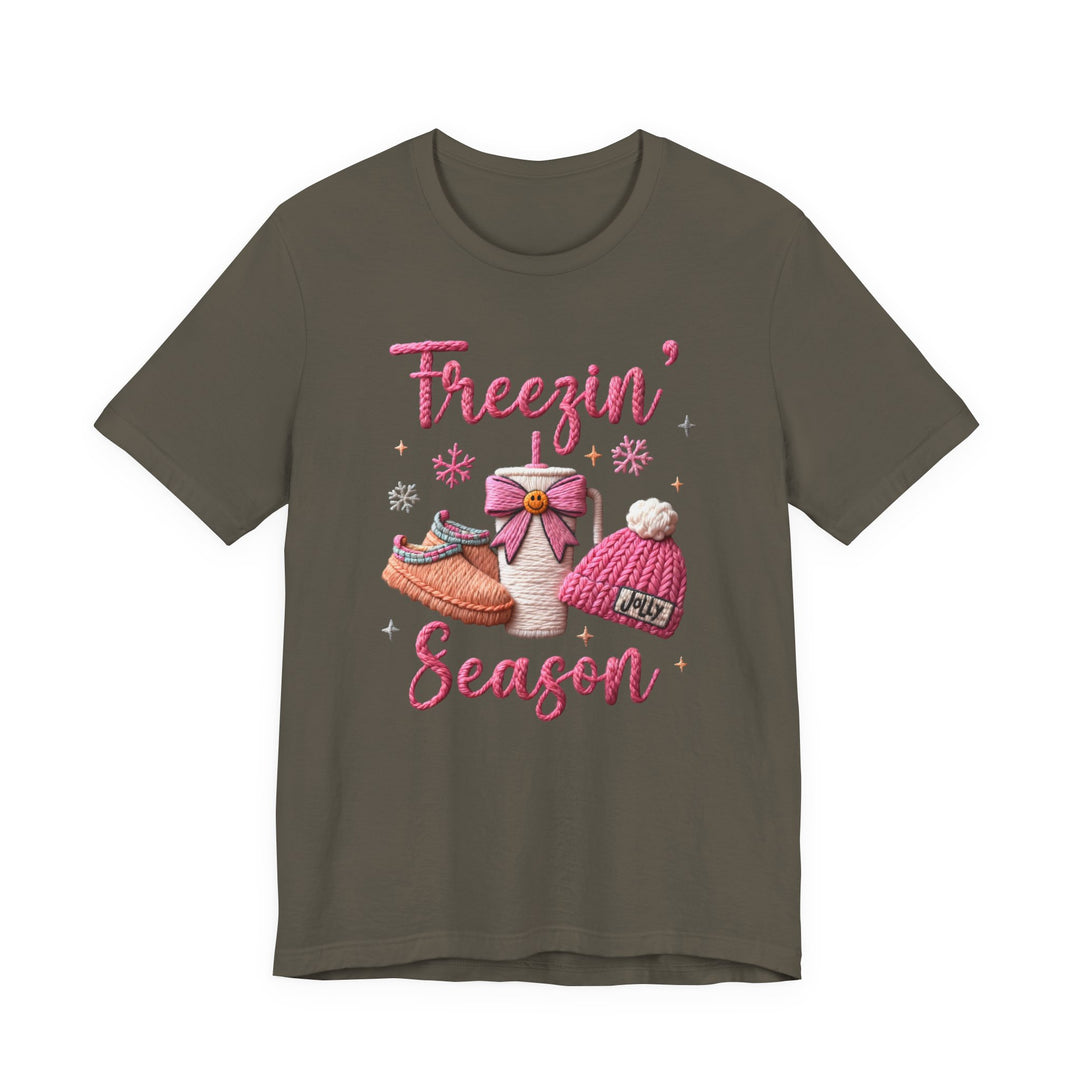 Freezin’ Season Tee with knit embroidery design featuring slippers, to-go cup, pom-pom beanie, snowflakes; soft cotton, unisex fit, from Faith Family Designs.