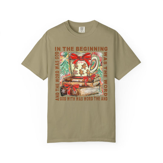 In the Beginning Tee featuring a Christmas-themed graphic of books, fir trees, and scripture from John 1:1, emphasizing faith and unique style.