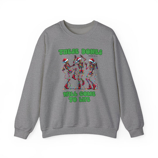 Heather-gray crewneck sweatshirt with festive graphic of three Santa-hat-wearing skeletons and Biblical reference, ideal for cozy, stylish wear.