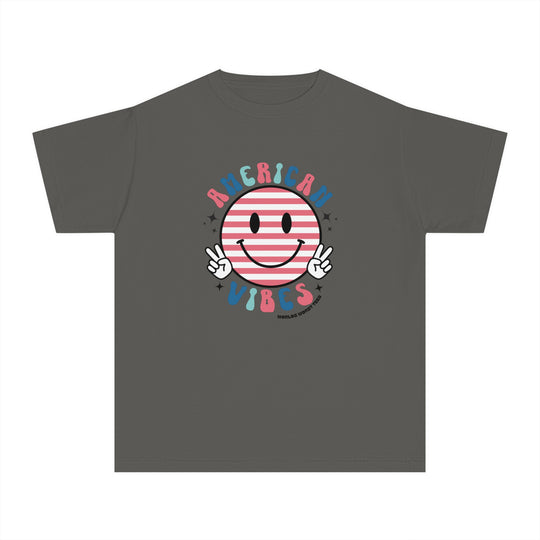 American Vibes Youth Tee: A grey t-shirt featuring a smiley face cartoon design, perfect for active kids. Made of soft-washed, 100% combed ringspun cotton for comfort and agility. Classic fit for all-day wear.