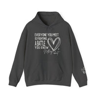 Charcoal-gray Fighting a Battle hoodie with kangaroo pocket, drawstring hood, and white motivational text with heart graphic on chest; Be Kind on sleeve.