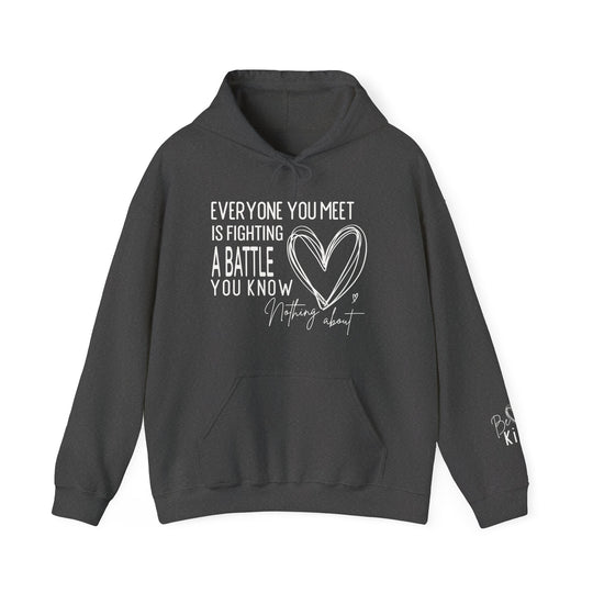 Charcoal-gray Fighting a Battle hoodie with kangaroo pocket, drawstring hood, and white motivational text with heart graphic on chest; Be Kind on sleeve.