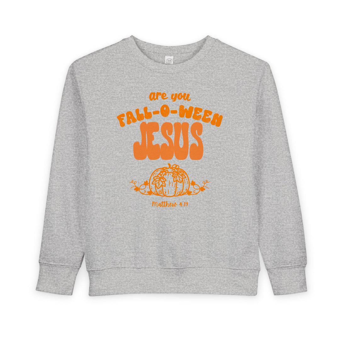 Light-gray toddler crewneck sweatshirt with are you FALL-O-WEEN JESUS in orange bubble letters, featuring a pumpkin illustration and Matthew 4:19 text below.