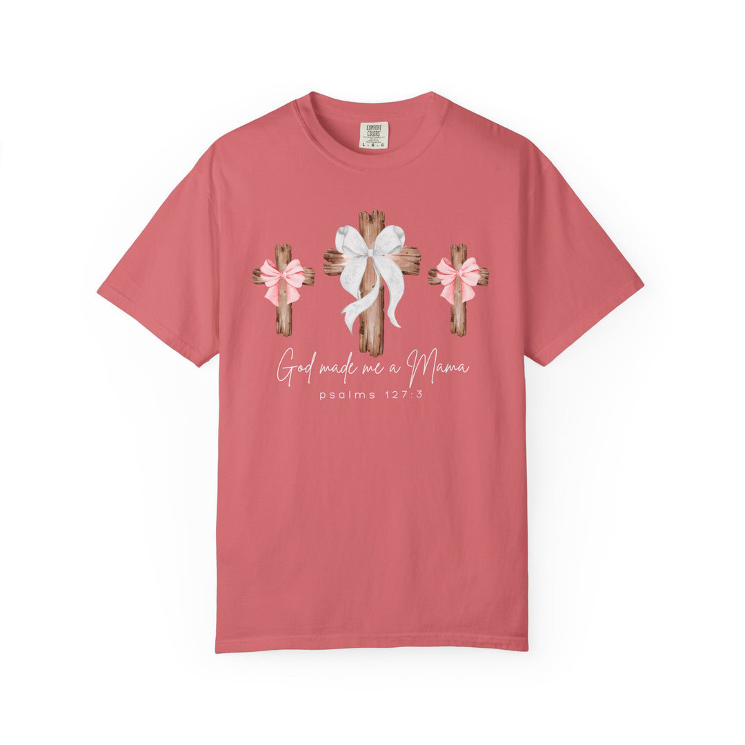 God Made Me a Mama Tee features rustic crosses with bows and hand-lettered text on a coral Comfort Colors T-shirt, offering a cozy, relaxed fit.
