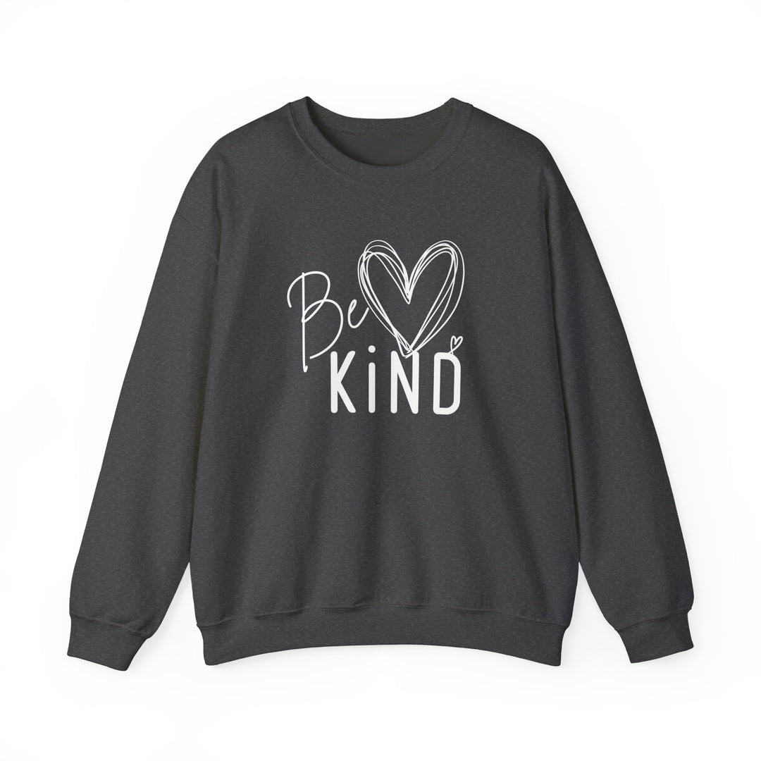 Dark-charcoal crewneck sweatshirt with Be Kind graphic, featuring a handwritten script and block letters, accented by sketched hearts. Unisex, cozy, and durable.