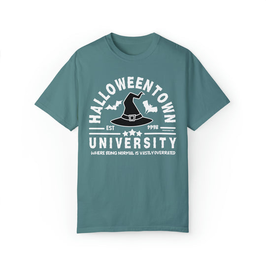 A Halloweentown University Tee featuring a hat and bat design on a t-shirt. Unisex, garment-dyed sweatshirt with 80% ring-spun cotton and 20% polyester, relaxed fit, rolled-forward shoulder, and back neck patch.