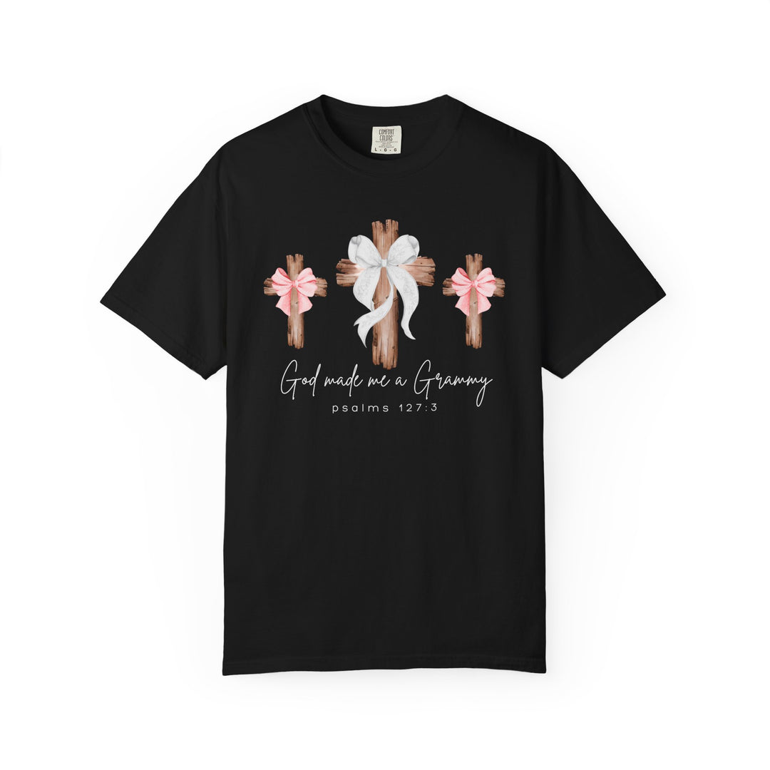 God Made Me a Grammy Tee featuring rustic wooden crosses with bows, script text, and Psalms 127:3, on a black, relaxed-fit, ring-spun cotton T-shirt.