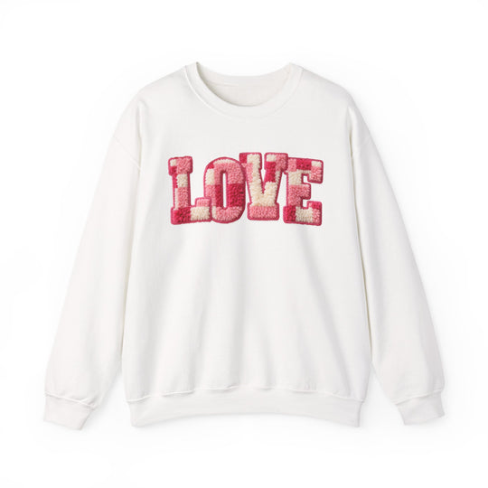 Love Crew sweatshirt with LOVE in pink-and-cream tufted letters, showcasing a unisex, comfortable fit, ideal for casual wear.